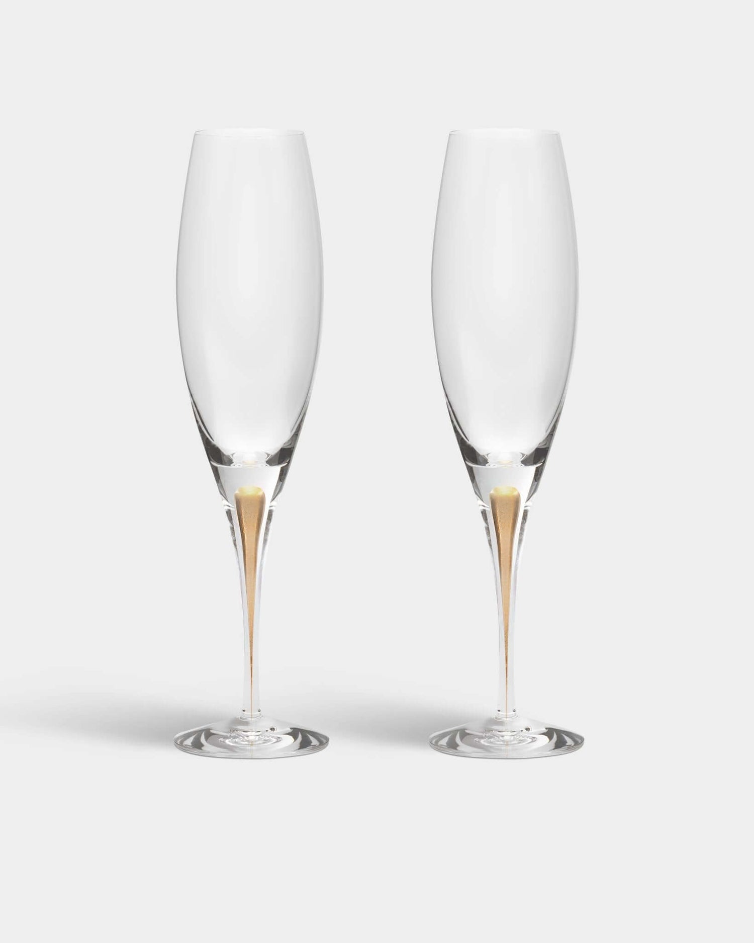 Orrefors Intermezzo Gold Champagne Flutes (7oz): Celebrate in Style - DWELL by CMOrrefors