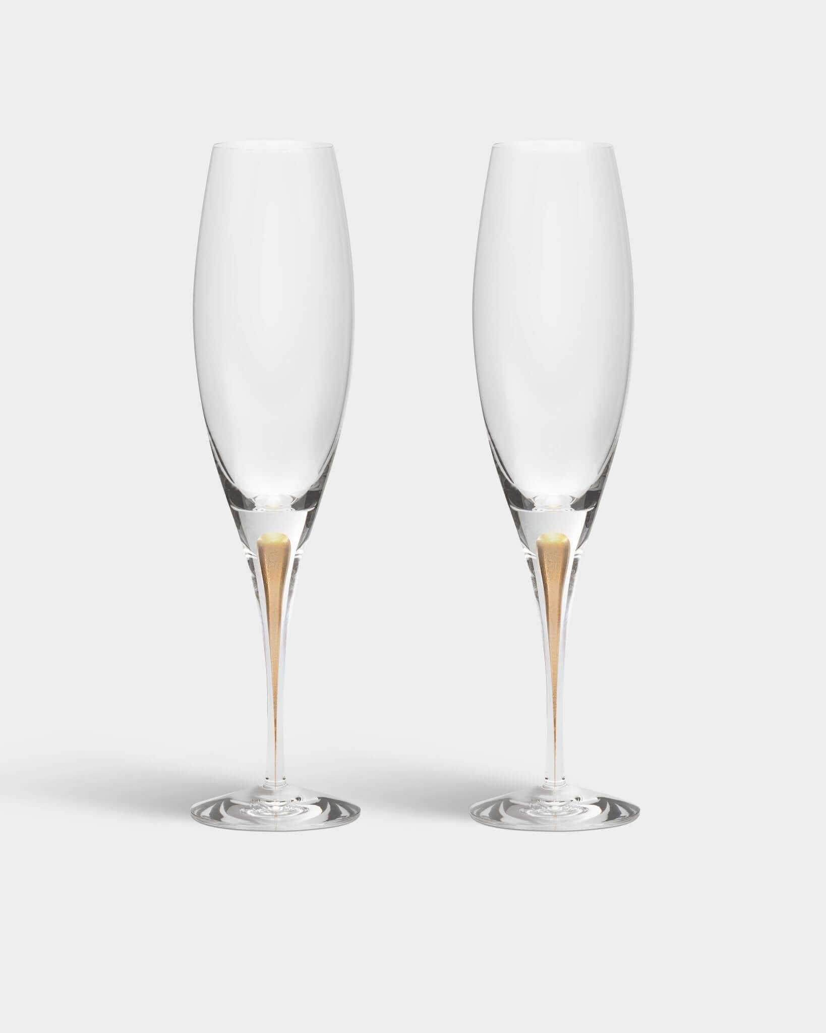 Orrefors Intermezzo Gold Champagne Flutes (7oz): Celebrate in Style - DWELL by CM